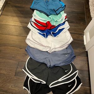 8 pairs size large Nike running shorts